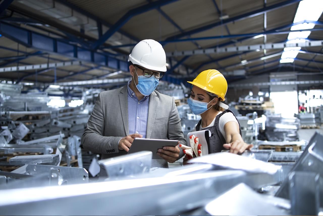 industrial factory worker working in metal manufacturing industry